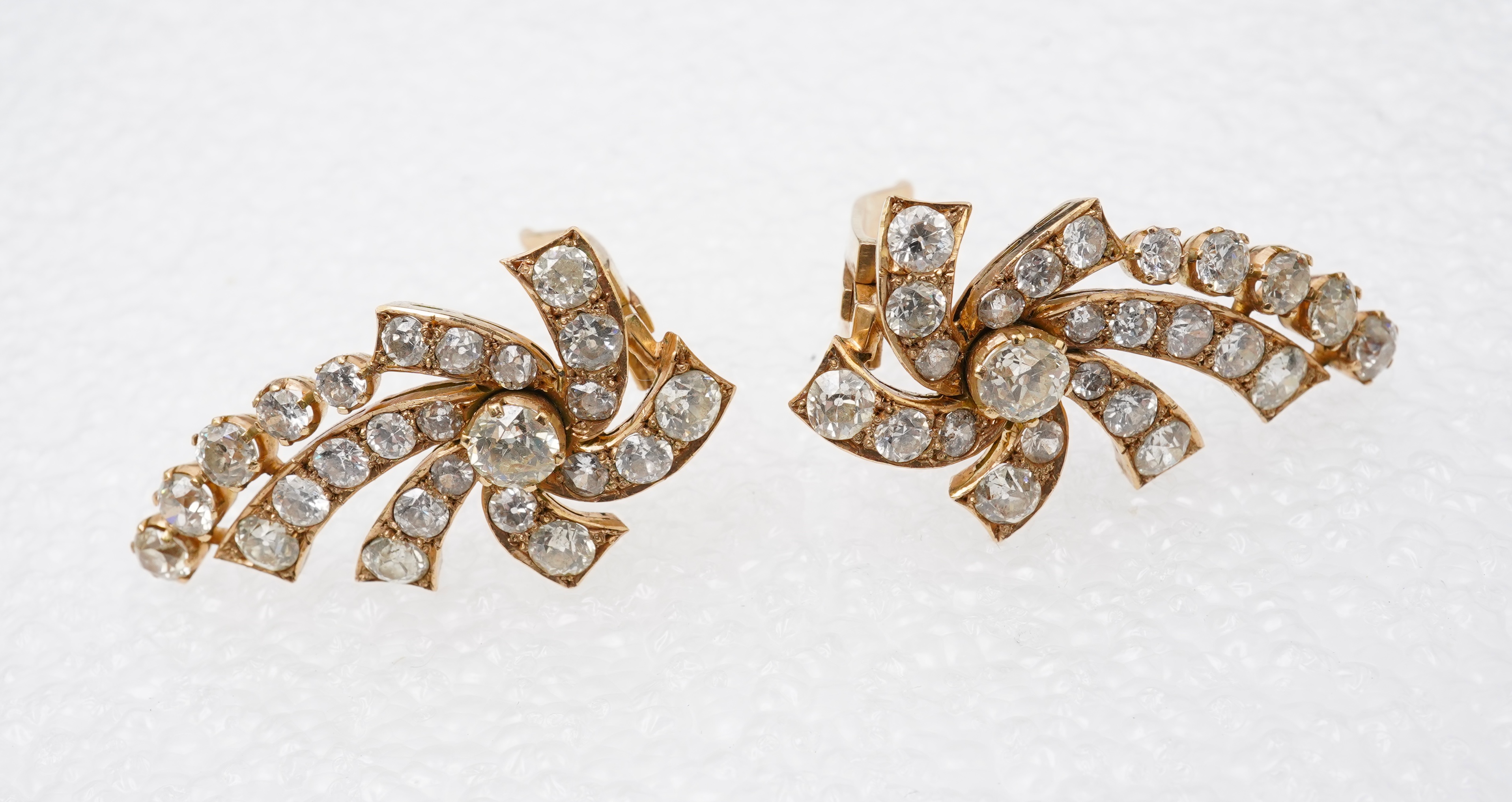 A pair of diamond ear clips, mid 20th century